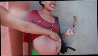 Video 881602801: pregnant mom, big pregnant belly, eating pregnant, street mom, straight street, mom picked